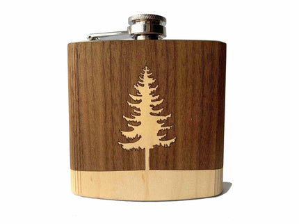 Wooden flask with a laser-cut tree design on a white background