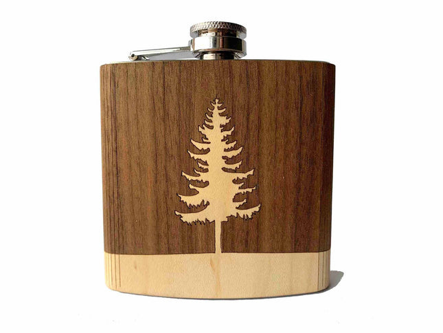 Wooden flask with a laser-cut tree design on a white background