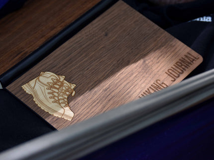 Wooden journal with a leather-bound cover and 'Walking Journal' engraving.