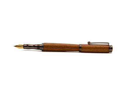 Wooden fountain pen with cap removed against white background.