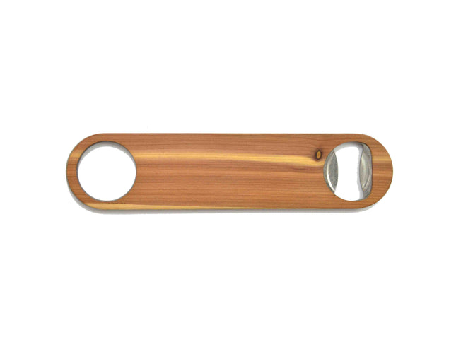 Wooden bottle opener with two circular cutouts on a white background