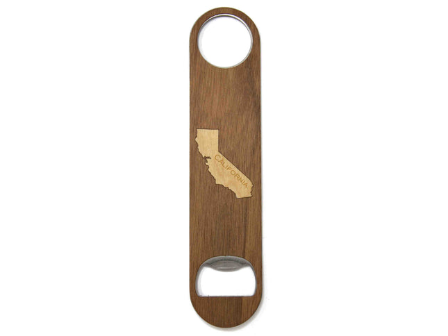Wooden bottle opener with California shape engraving on a white background