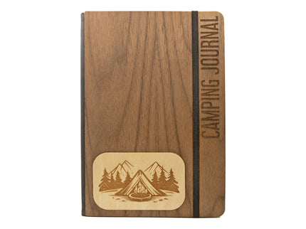Wooden camping journal with mountain and tent illustration on a white background