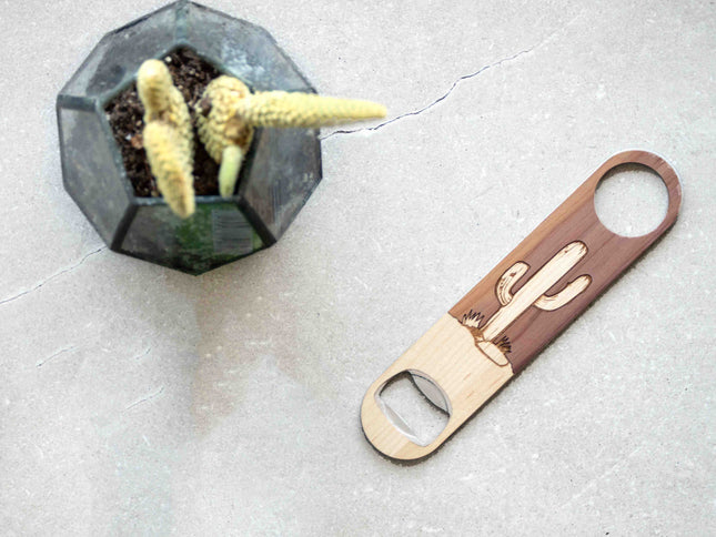 Bottle opener with cactus design on a light gray surface
