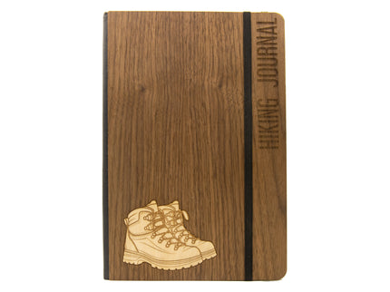 Wooden notebook with hiking boot design and 'Hiking Journal' text on a white background