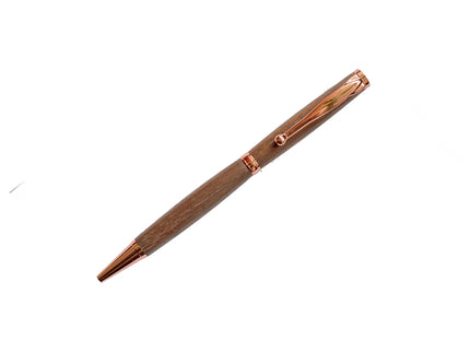 Wooden pen with rose gold accents on a white background