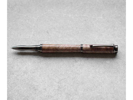 Wooden pen with metal accents on a gray background