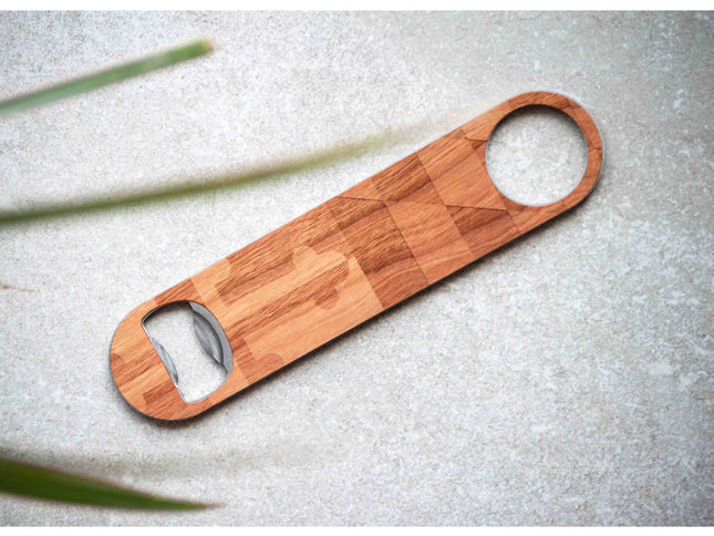 Wooden bottle opener on a textured surface