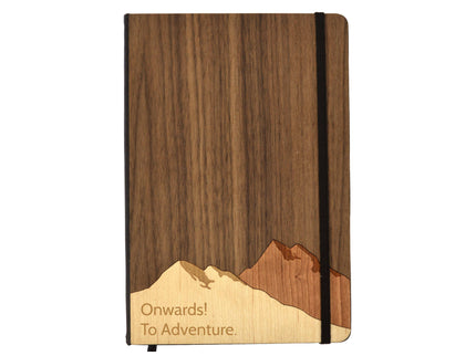Wooden notebook with mountain design and 'Onwards! To Adventure.' text on a white background