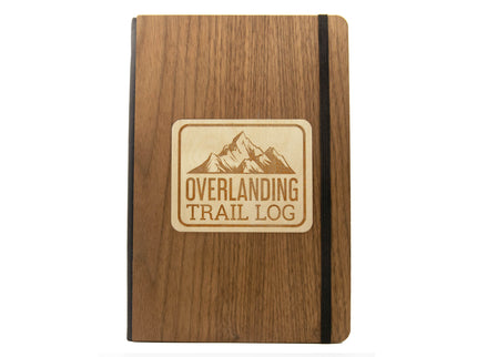 Wooden notebook with 'Overlanding Trail Log' logo on a white background