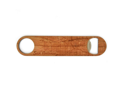Wooden bottle opener with 'San Antonio' engraving on a white background