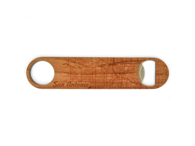 Wooden bottle opener with 'San Antonio' engraving on a white background