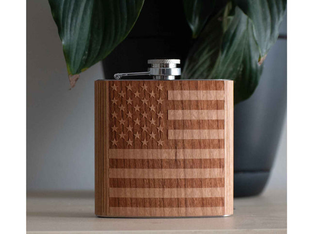 Wooden flask with American flag design on a neutral background