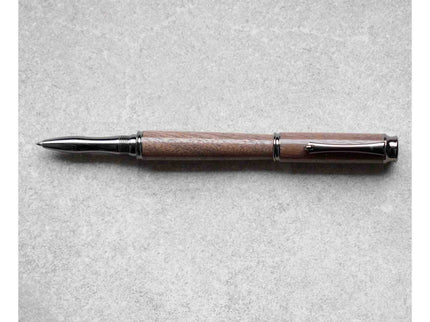 Pen with wooden grip and metal accents on a gray background