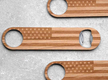 Close up of three engraved wood bottle openers with American Flag design