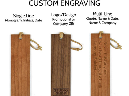 Three wooden bookmarks all engraved with different types of engravings.