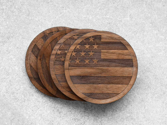 A set of 4 walnut coasters with the american flag engraved on them by Autumn Woods Co