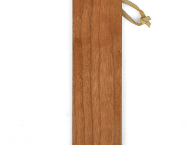 A personalized wooden bookmark with a leather loop, crafted from American Cherry hardwood, displayed against a white background.