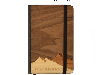 Small mountain range journal with custom engraving example against white background.